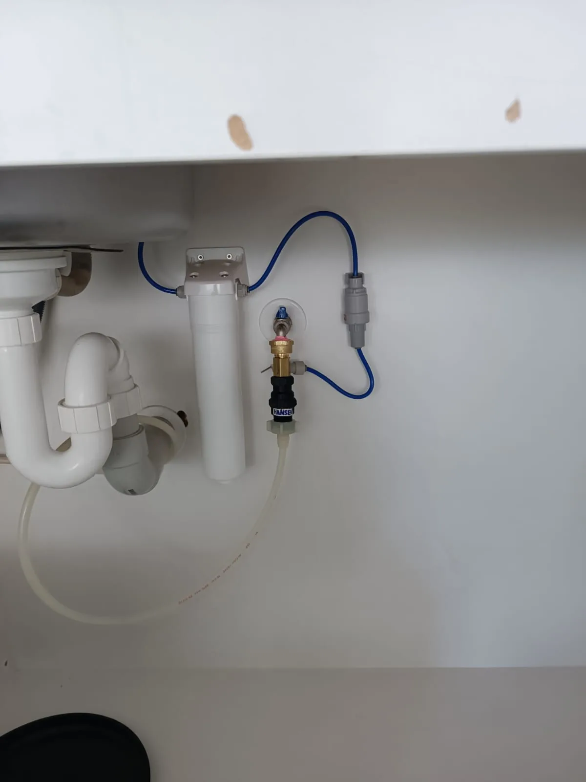 Under bench water filter installed beneath a kitchen sink for a rural property on tank or bore water